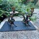 Pair of chimera candle holders in bronze, 19th century.