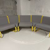 Yellow tubular modular bench & gray fabric
