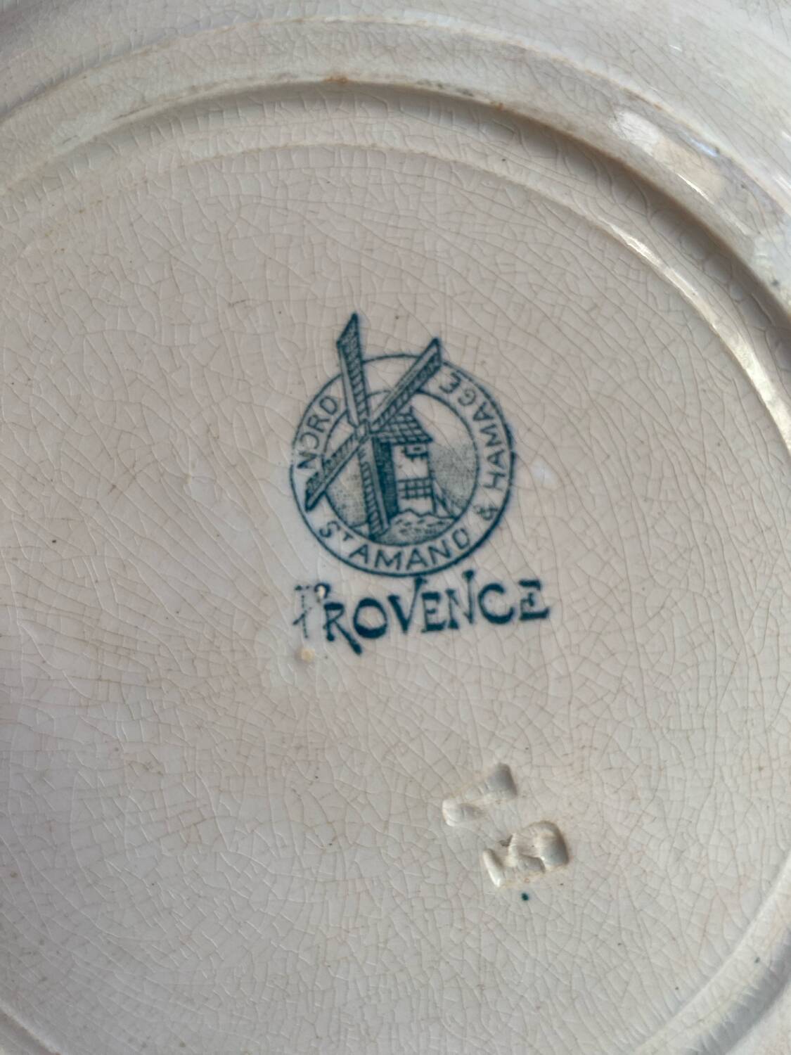 3 flat plates in ironstone with a floral green border.