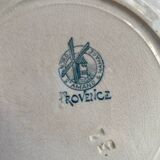 3 flat plates in ironstone with a floral green border.