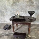 Coffee table, round antique Indonesian teak table with straight legs.