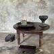 Coffee table, round antique Indonesian teak table with straight legs.