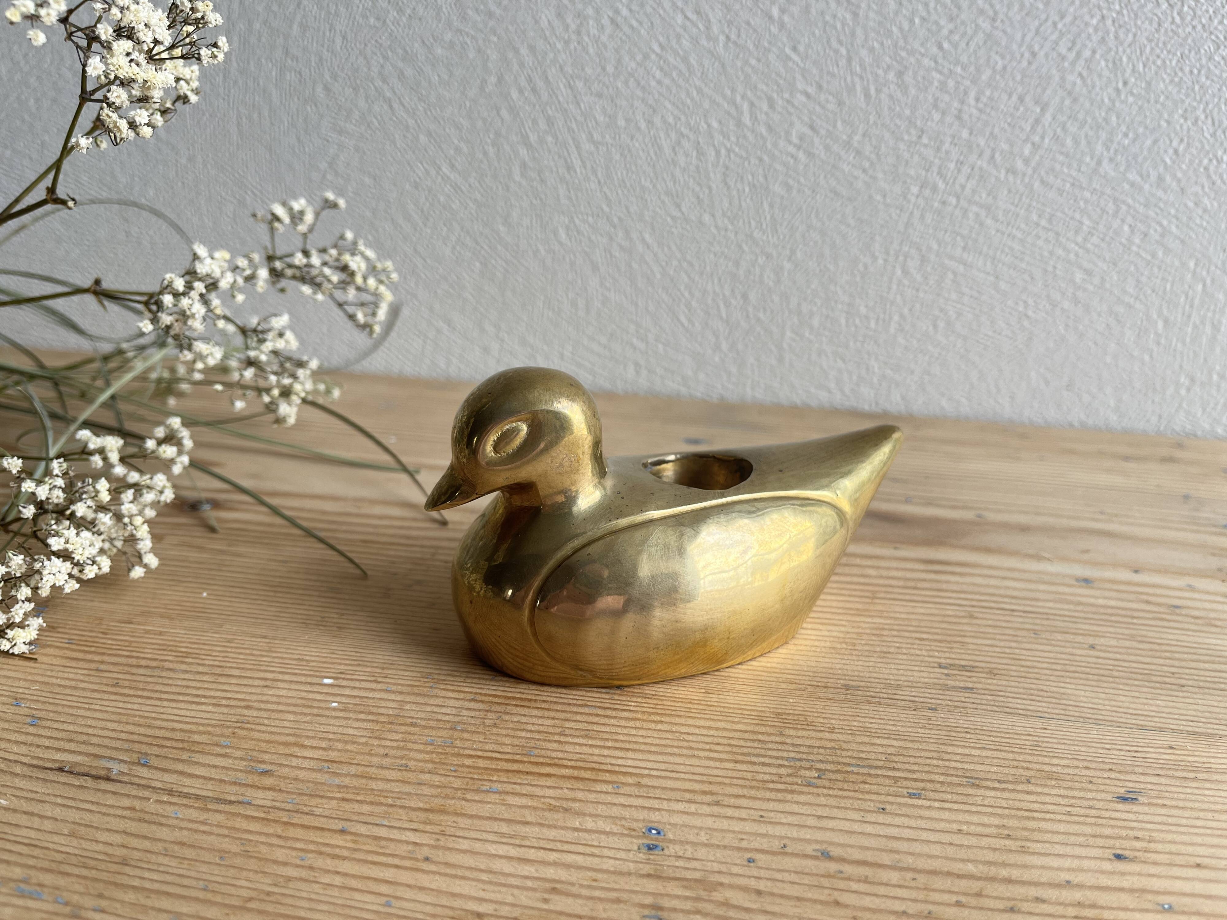 Brass duck candle holder