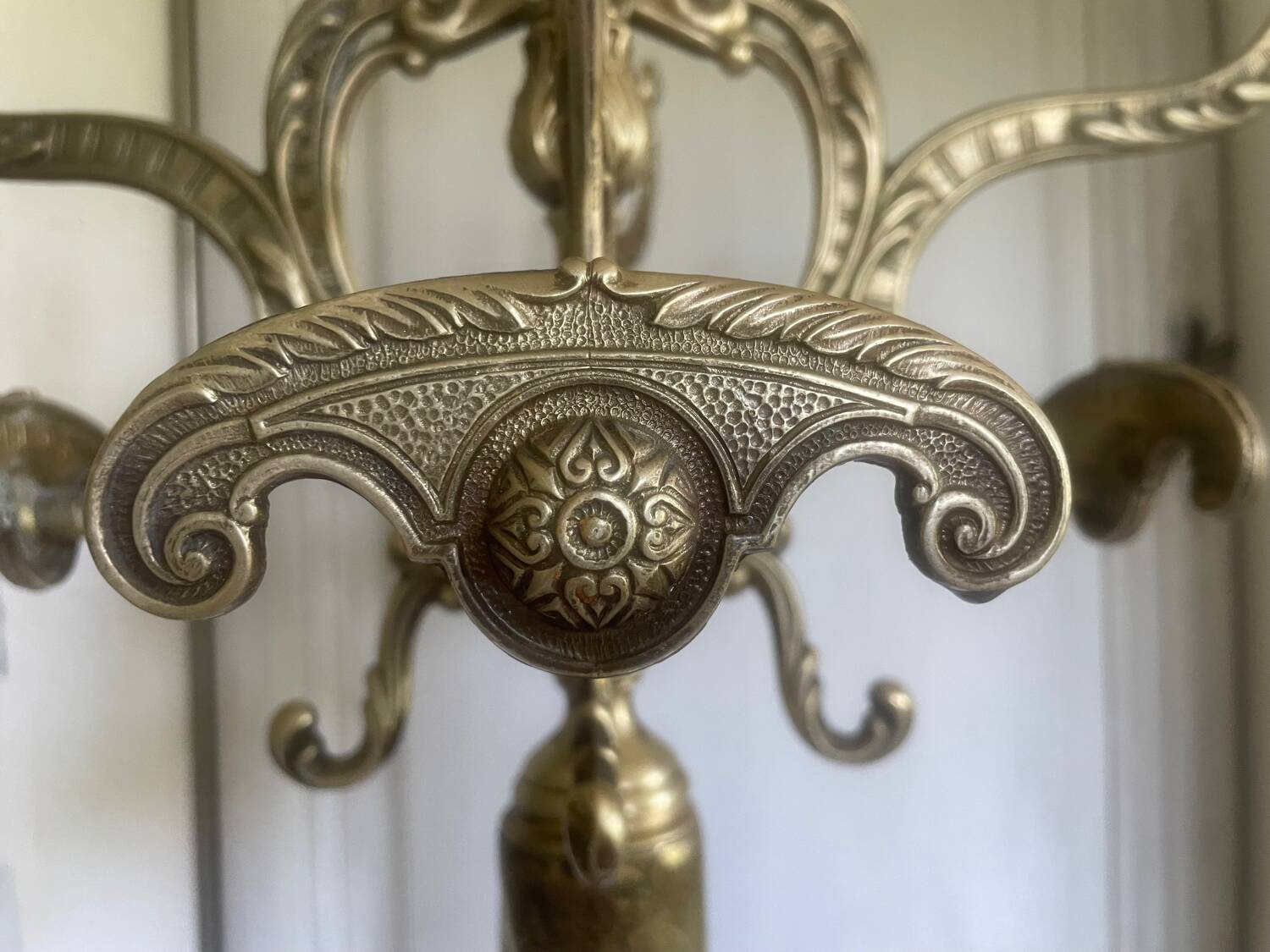 Freestanding brass coat rack