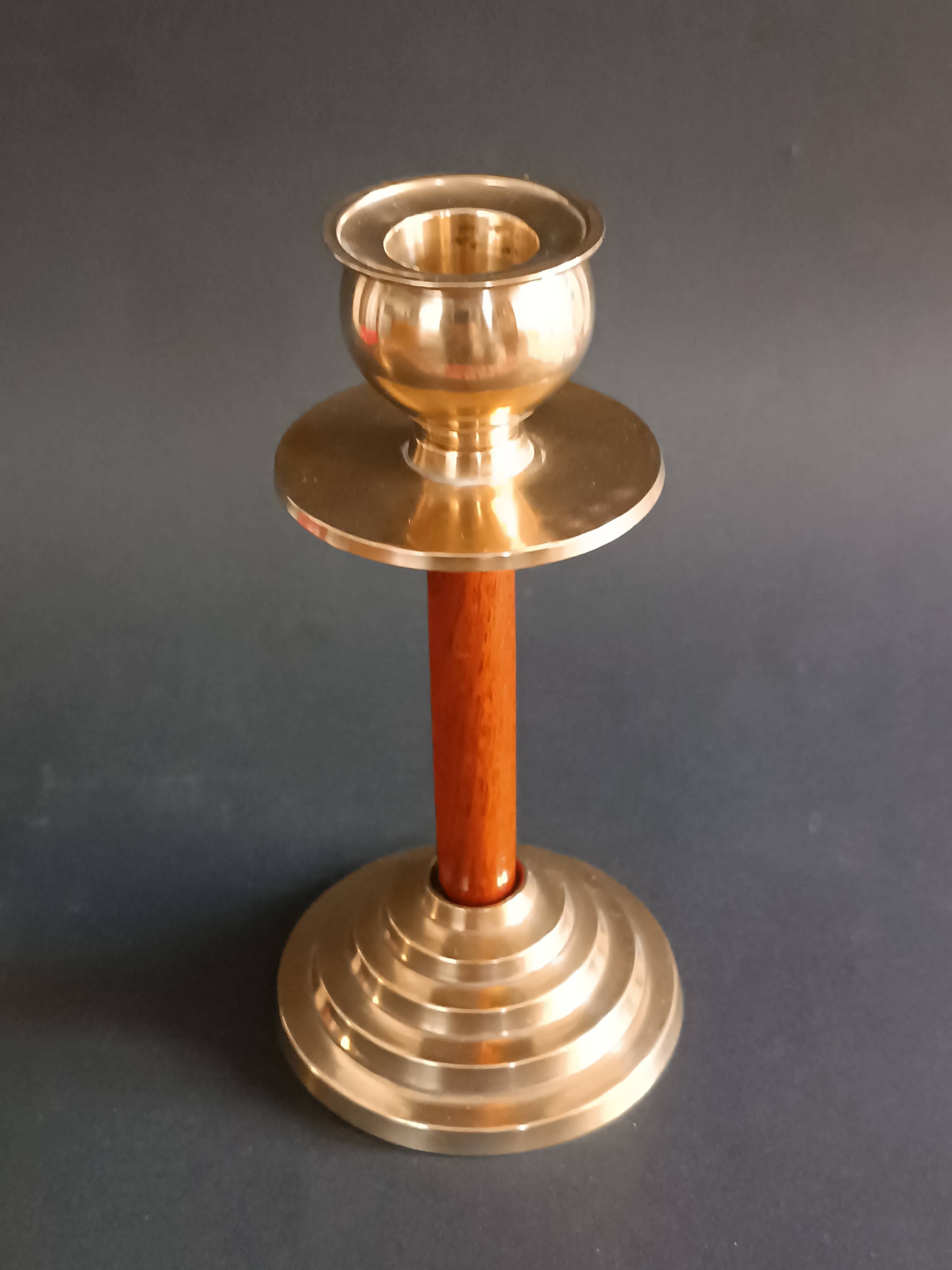 Two vintage wooden and brass candlesticks.