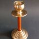 Two vintage wooden and brass candlesticks.