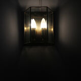 Wall sconce in brass and glass
