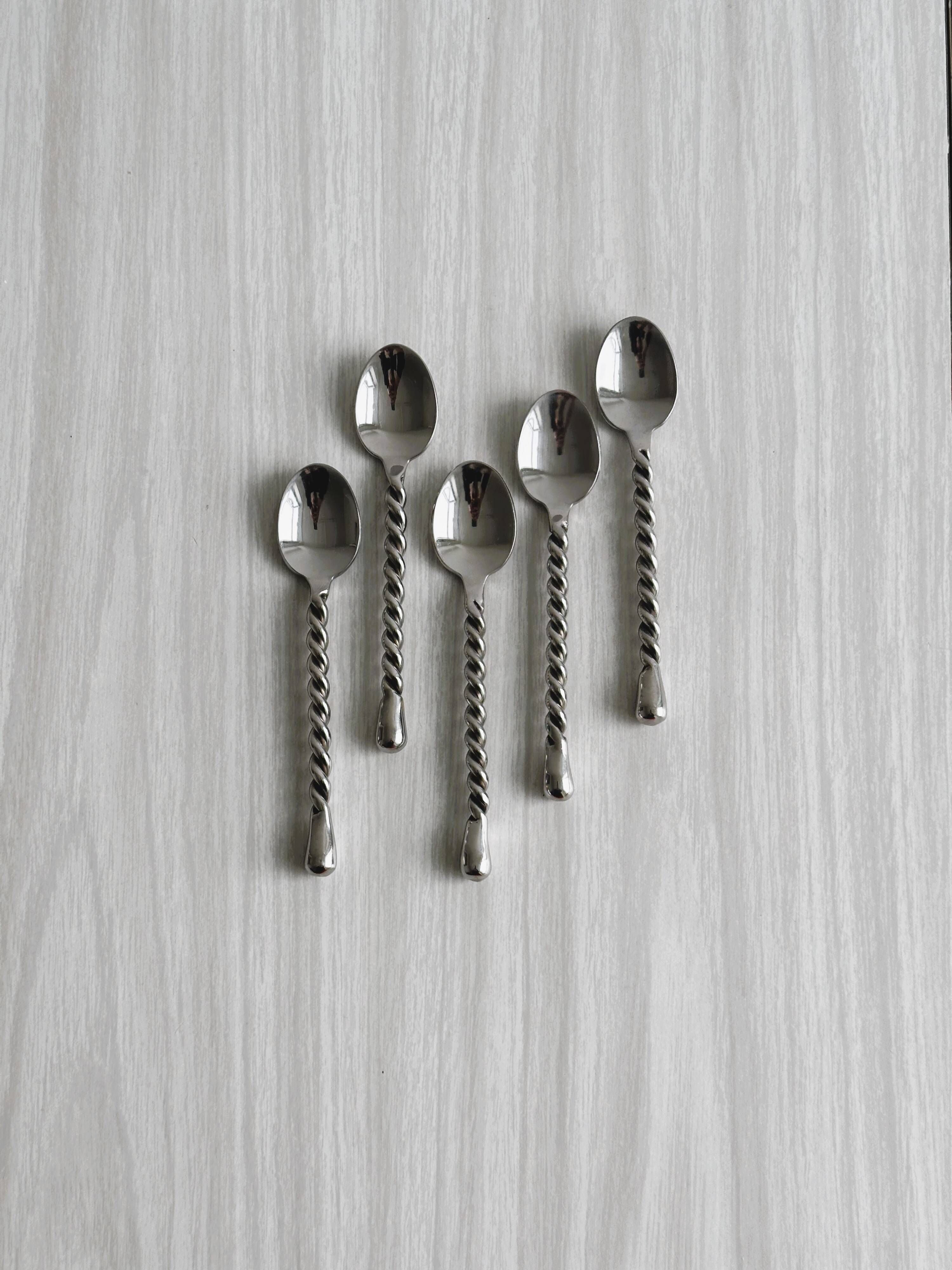 5 small twisted silver metal teaspoons