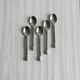 5 small twisted silver metal teaspoons