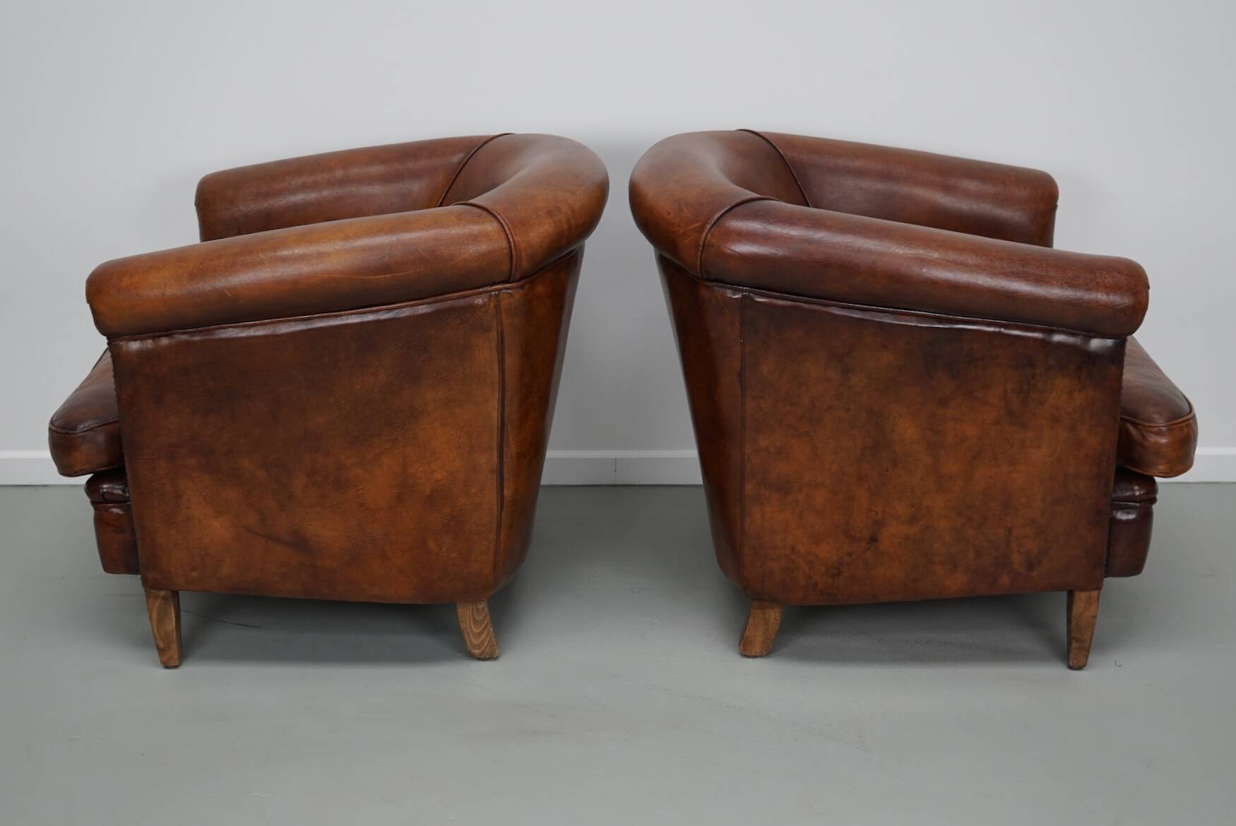 Vintage Dutch cognac coloured leather club chair, set of 2 with footstool