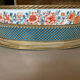 Porcelain planter with Japanese decoration, gilded brass base and rim, 20th century