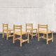 Set of 4 varnished wooden chairs, André Sornay