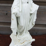 Ancient statuette of the virgin with the serpent in biscuit