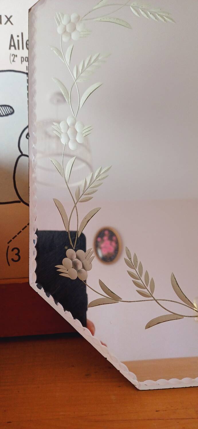 Beveled mirror with floral decor