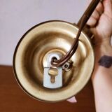 Brass wall lamp with pale pink bell