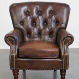 Cognac colored brown grained cowhide chesterfield armchair