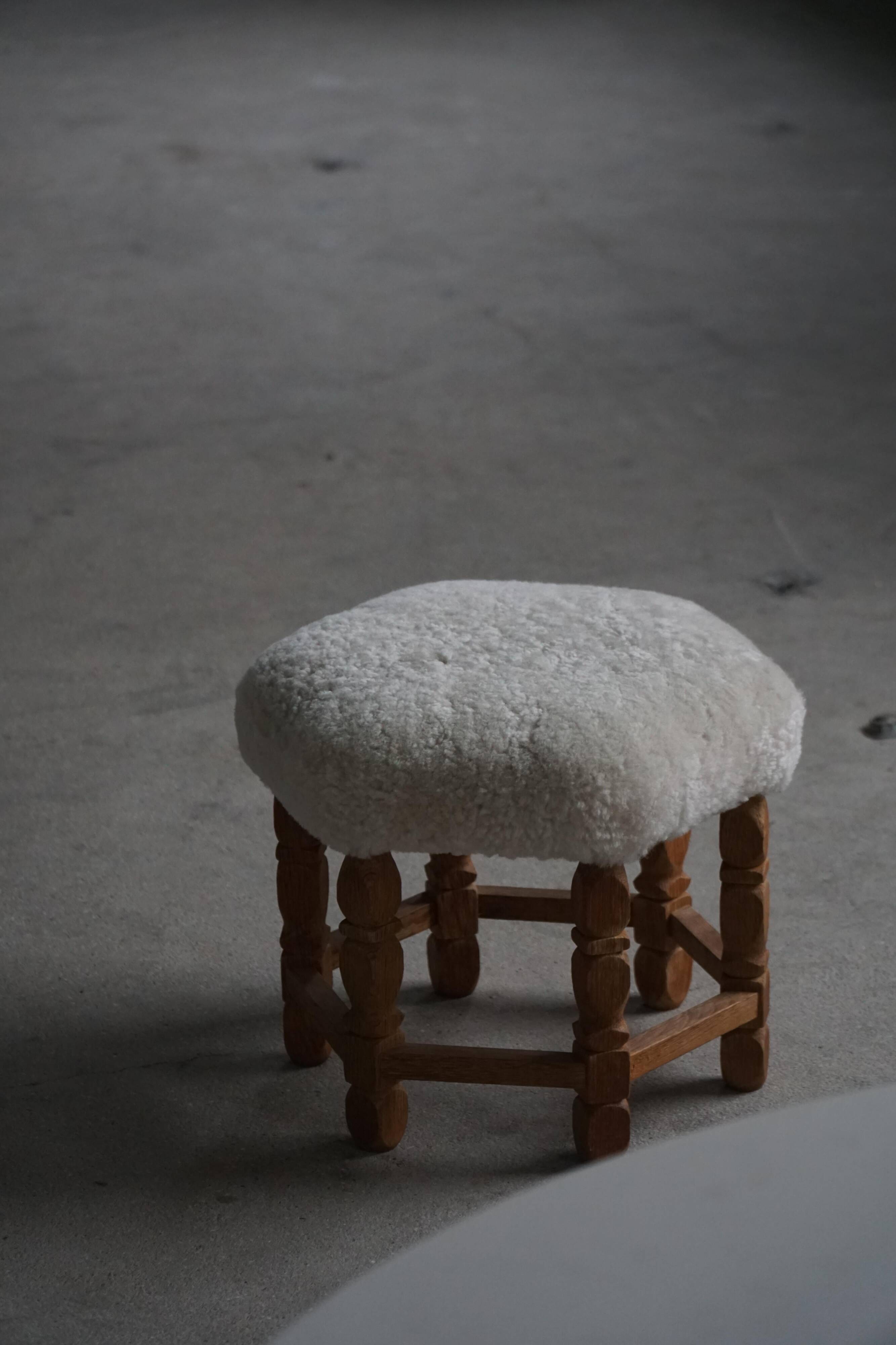 Mid-century Danish hexagonal oak stool with shearling lamb wool upholstery, 1950.