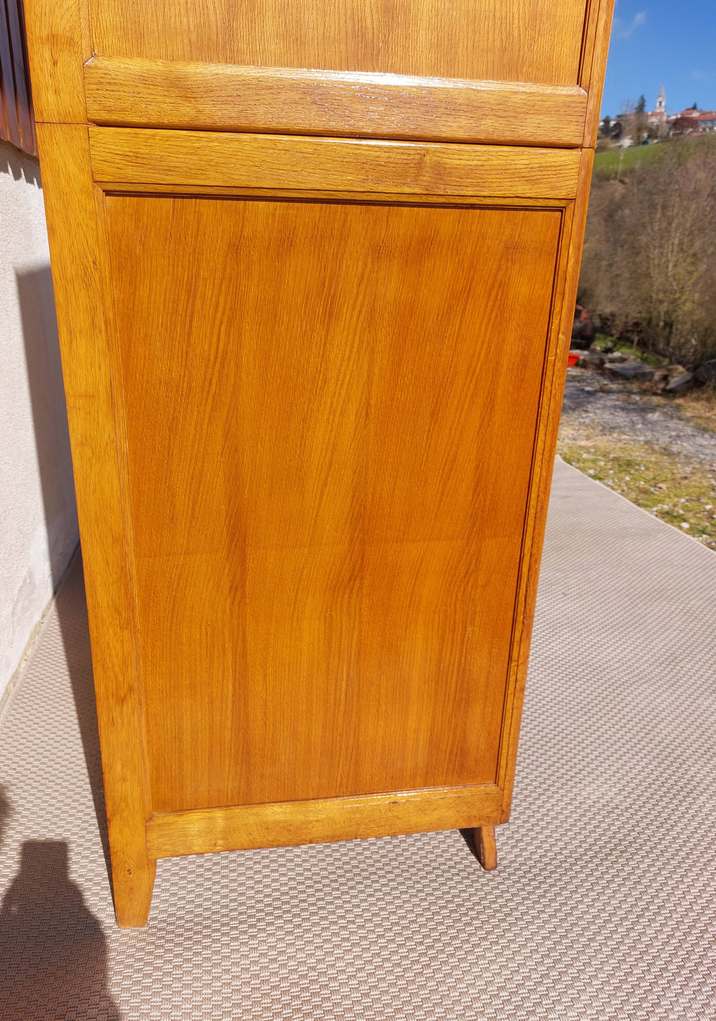 Vintage wardrobe with mirror and tapered legs.