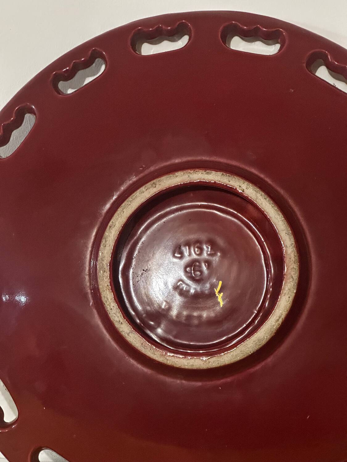 Burgundy and gold openwork plate in ceramic from Saint-Clement, 1950s.