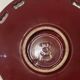 Burgundy and gold openwork plate in ceramic from Saint-Clement, 1950s.
