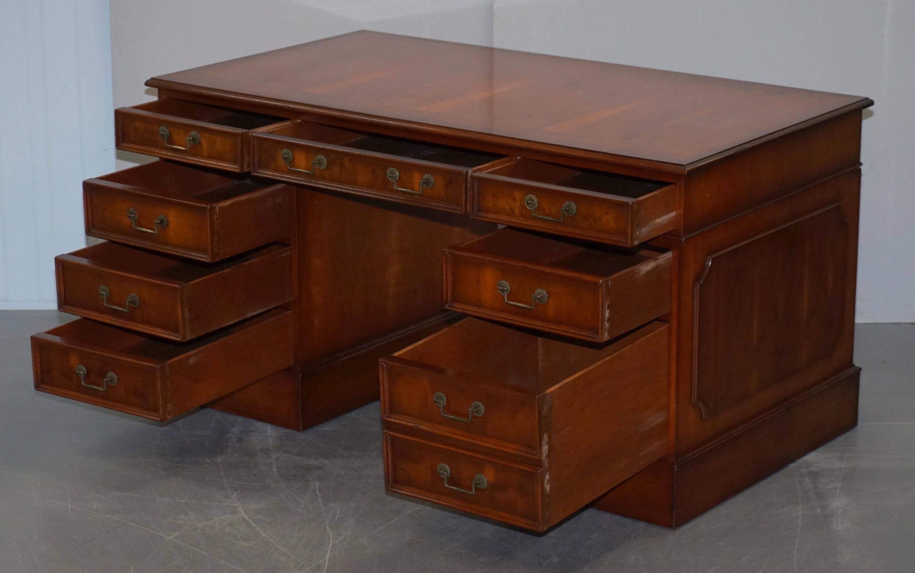 Partner desk with double pedestal in burr yew wood with decorated top.