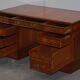 Partner desk with double pedestal in burr yew wood with decorated top.