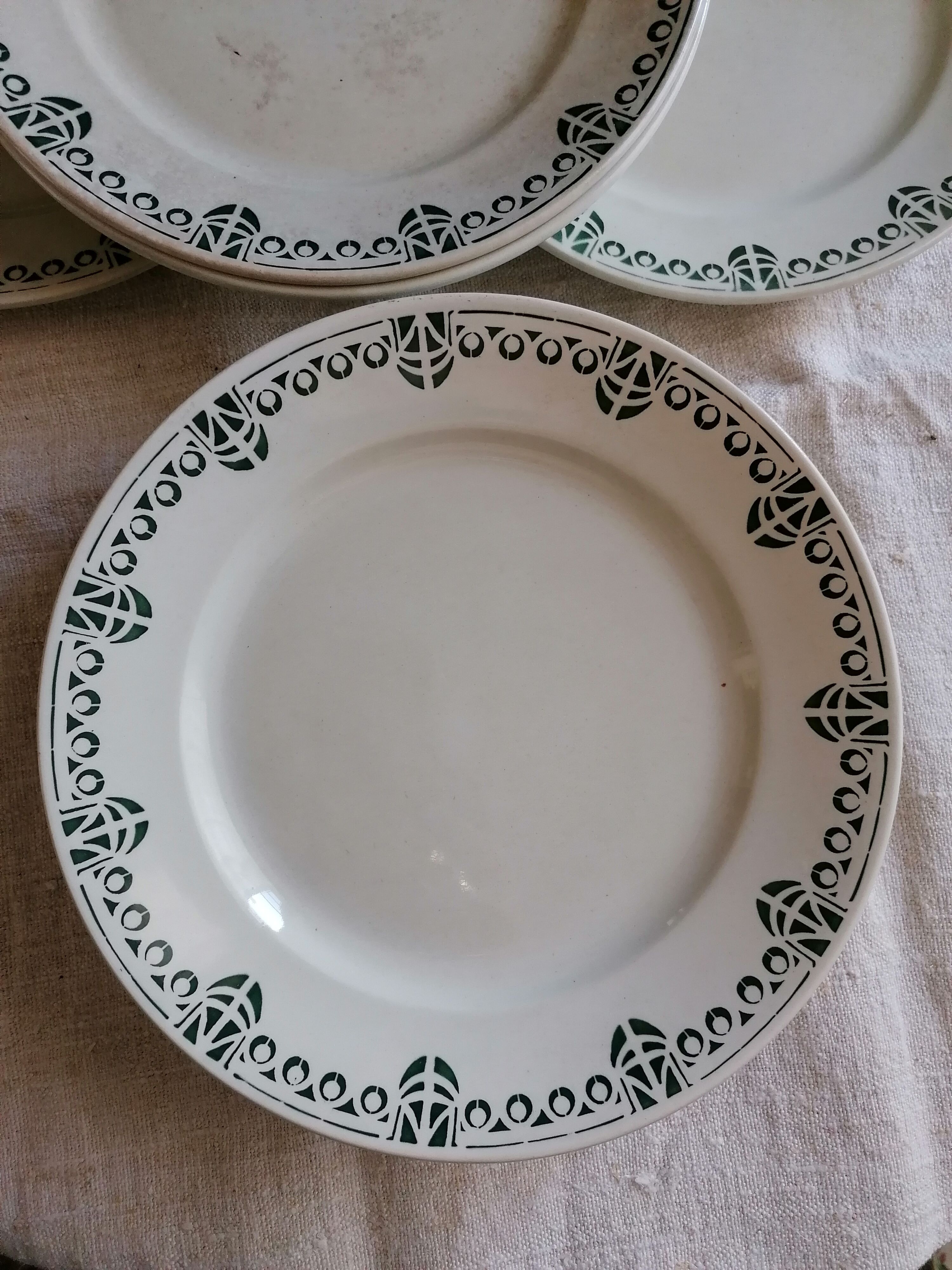 Set of 11 flat earthenware plates