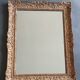 Large Montparnasse rocaille style frame in carved wood mounted in mirror.