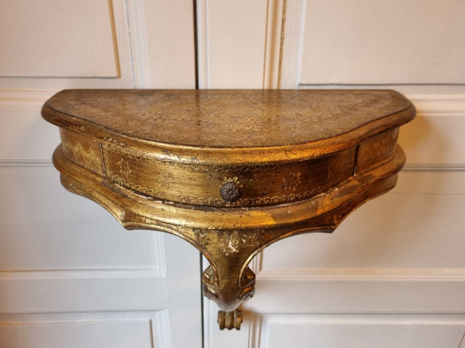 Mid-19th century wall console in wood and gilded stucco