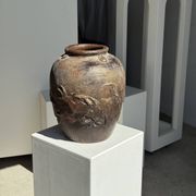 Large traditional Indonesian clay pot featuring a dragon.