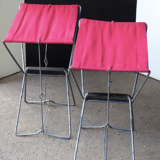 Pair of folding stools in red canvas and metal