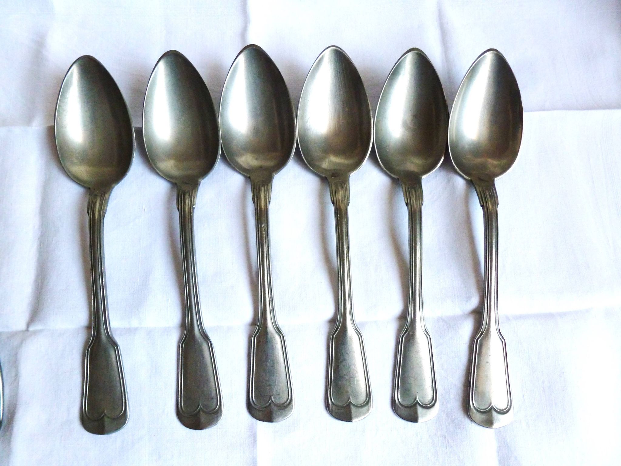 Art Deco cutlery, spoons, forks and table knives.