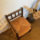 Corner chair in turned wood and straw