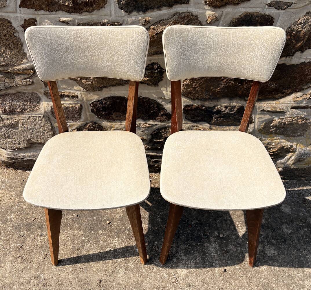 Pair of vintage chairs with upholstered backrest and seat, 1950s style.