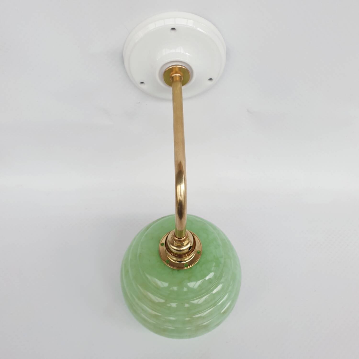 Brass collar and speckled glass wall lamp