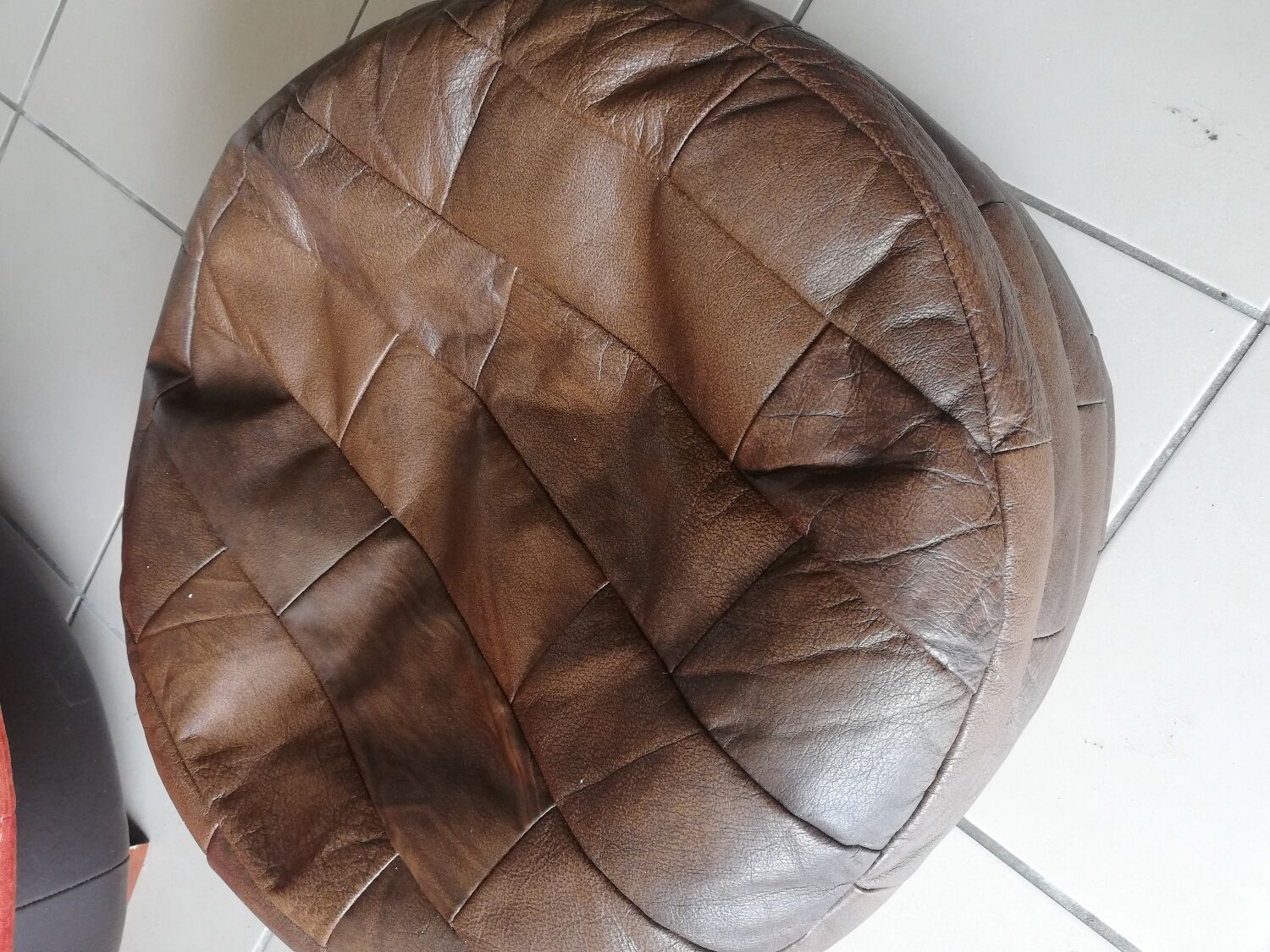 Brown round pouf imitation leather