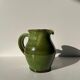 Green glazed ceramic pitcher