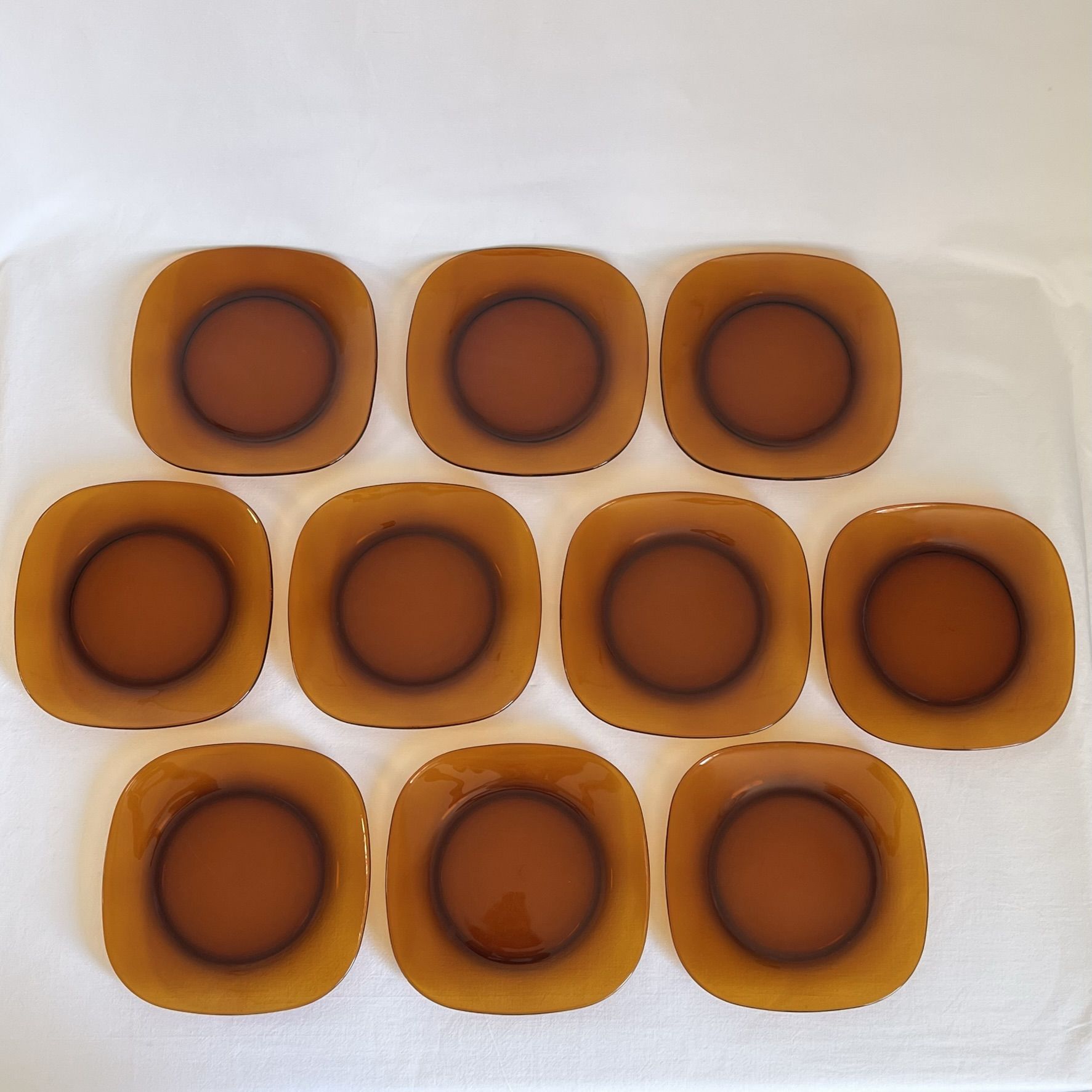 Set of 10 square Vereco plates in amber glass