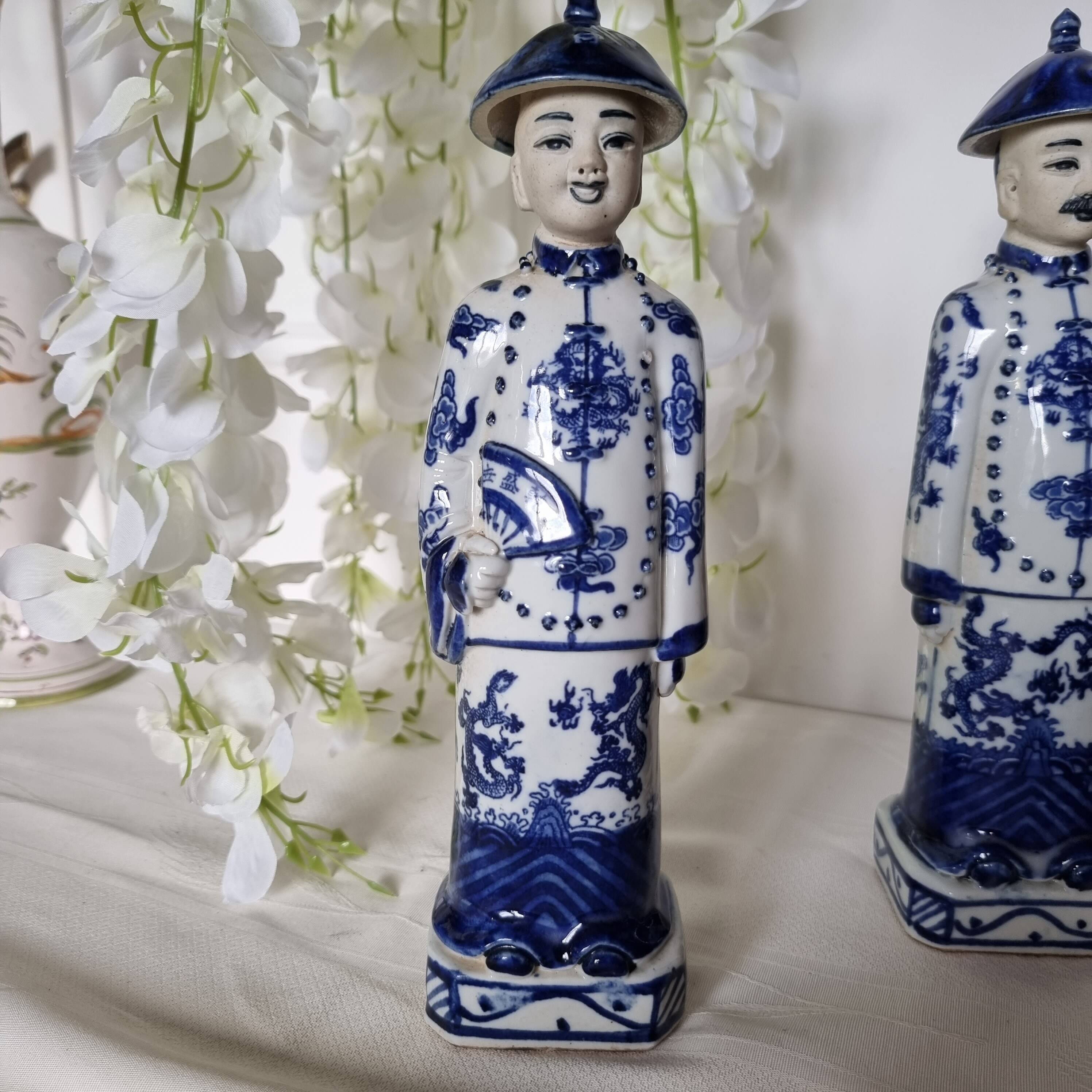 Pair of vintage Chinese blue and white porcelain figurines depicting