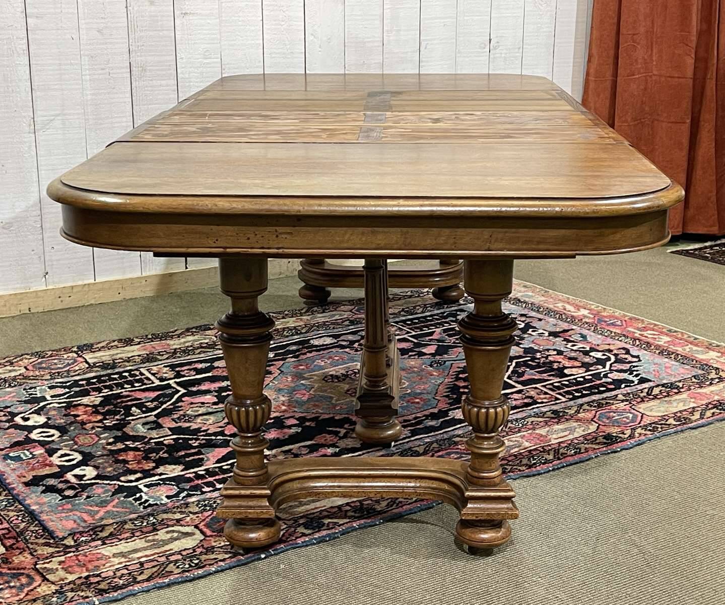 Henri II walnut table from the early 20th century with extensions.