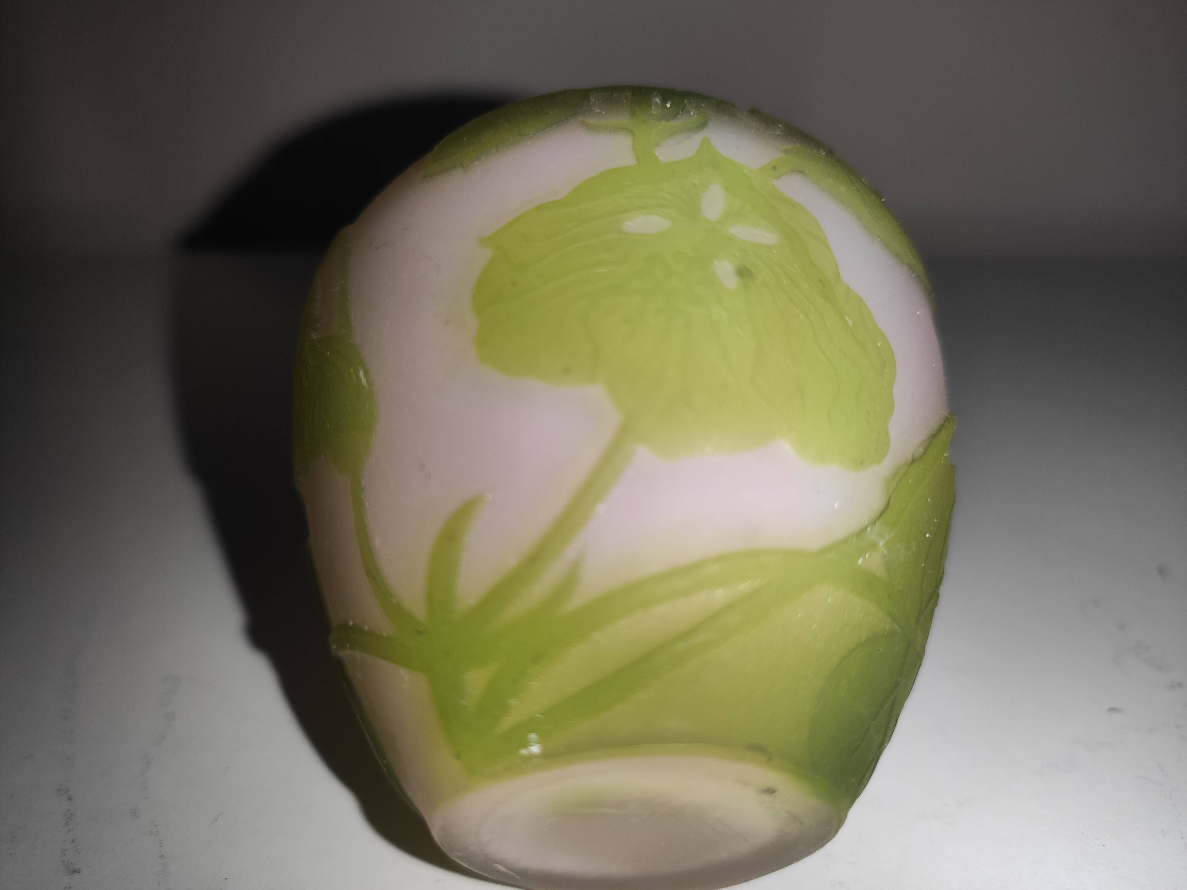 Small E. Gallé vase, "star" signature, light green tone on white background.