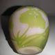 Small E. Gallé vase, "star" signature, light green tone on white background.