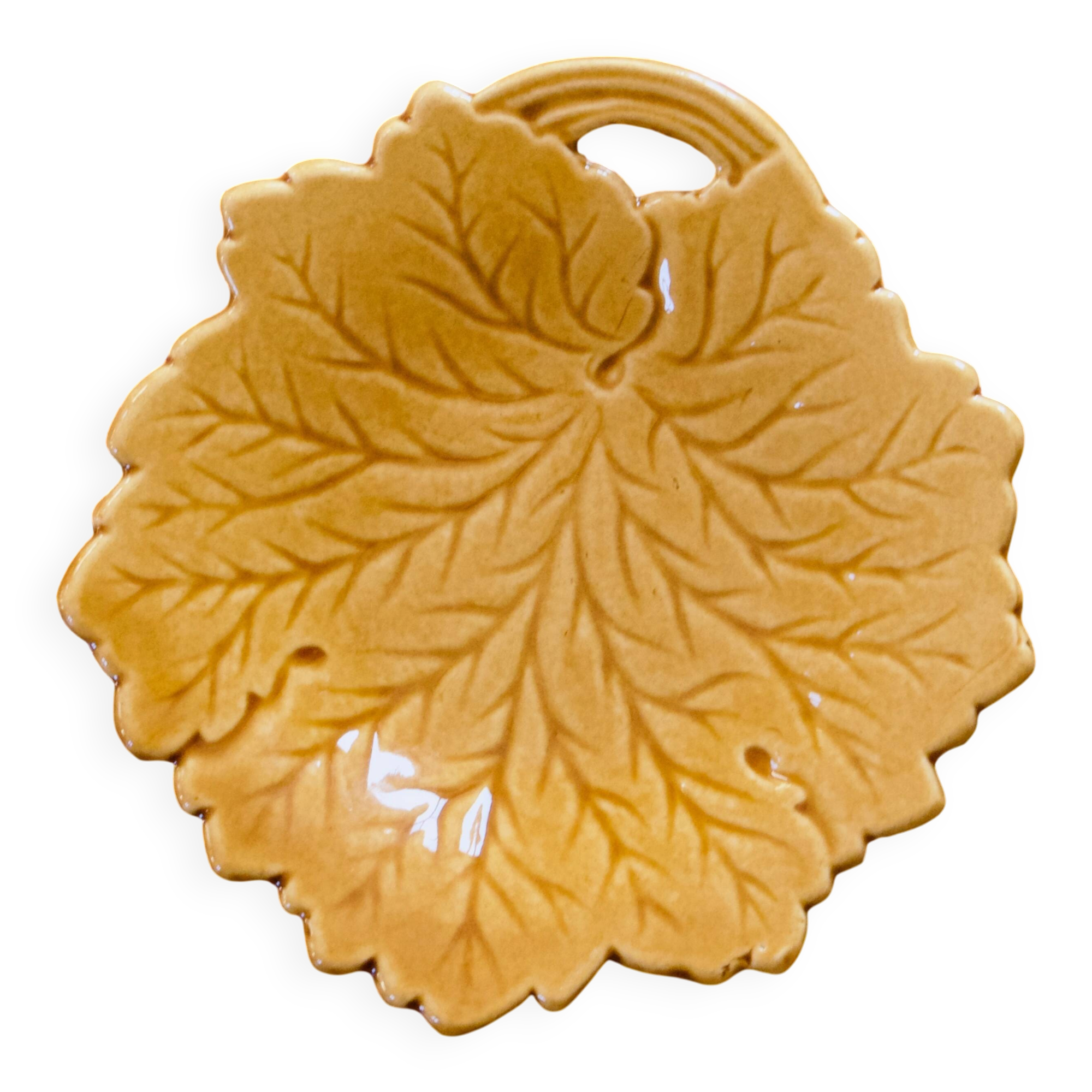 Vintage soap dish in ochre faience, leaf shape.