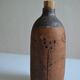 Bottle vase decorative flowers ceramic signature with fish to identify.