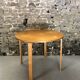 Round dining table in vintage wood