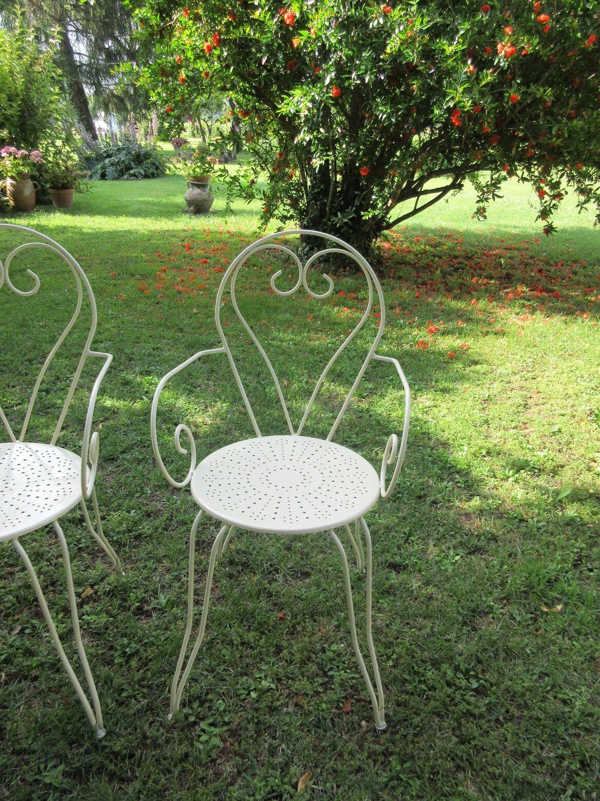 Pair of wrought iron armchairs