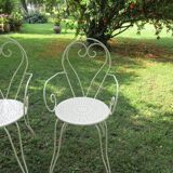 Pair of wrought iron armchairs