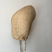 Woven rattan wall light in the style of Igno Maurer, design from the 1970s.