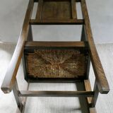 Armchair in carved solid wood with straw seat