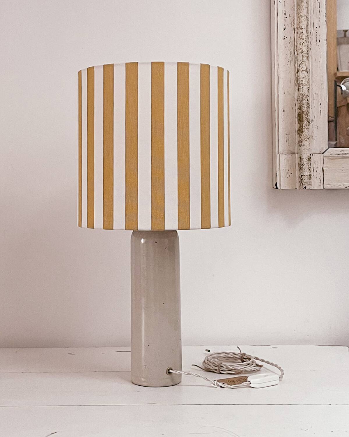 Sandstone lamp and striped lampshade
